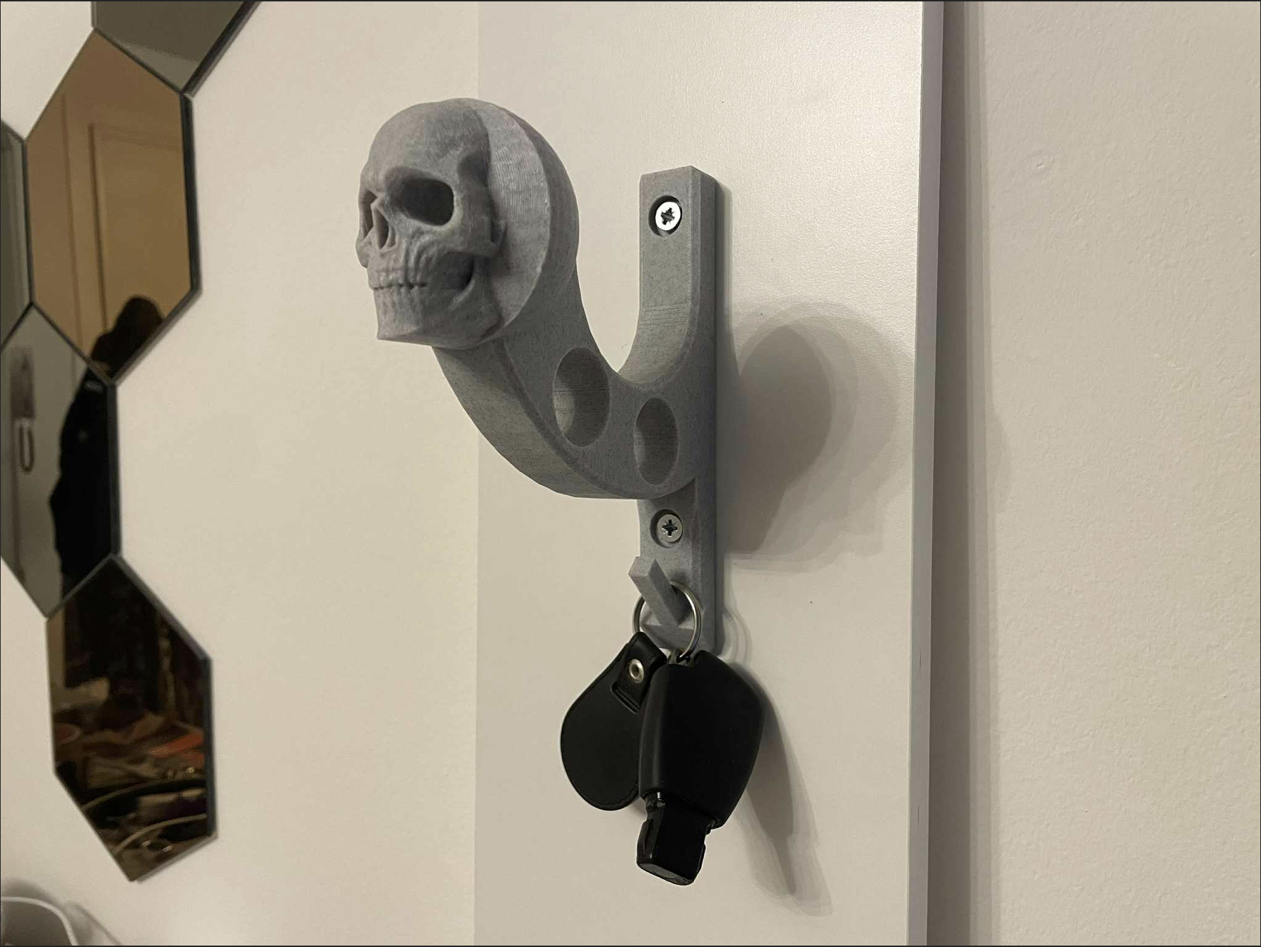Helmet holder, keys and jacket